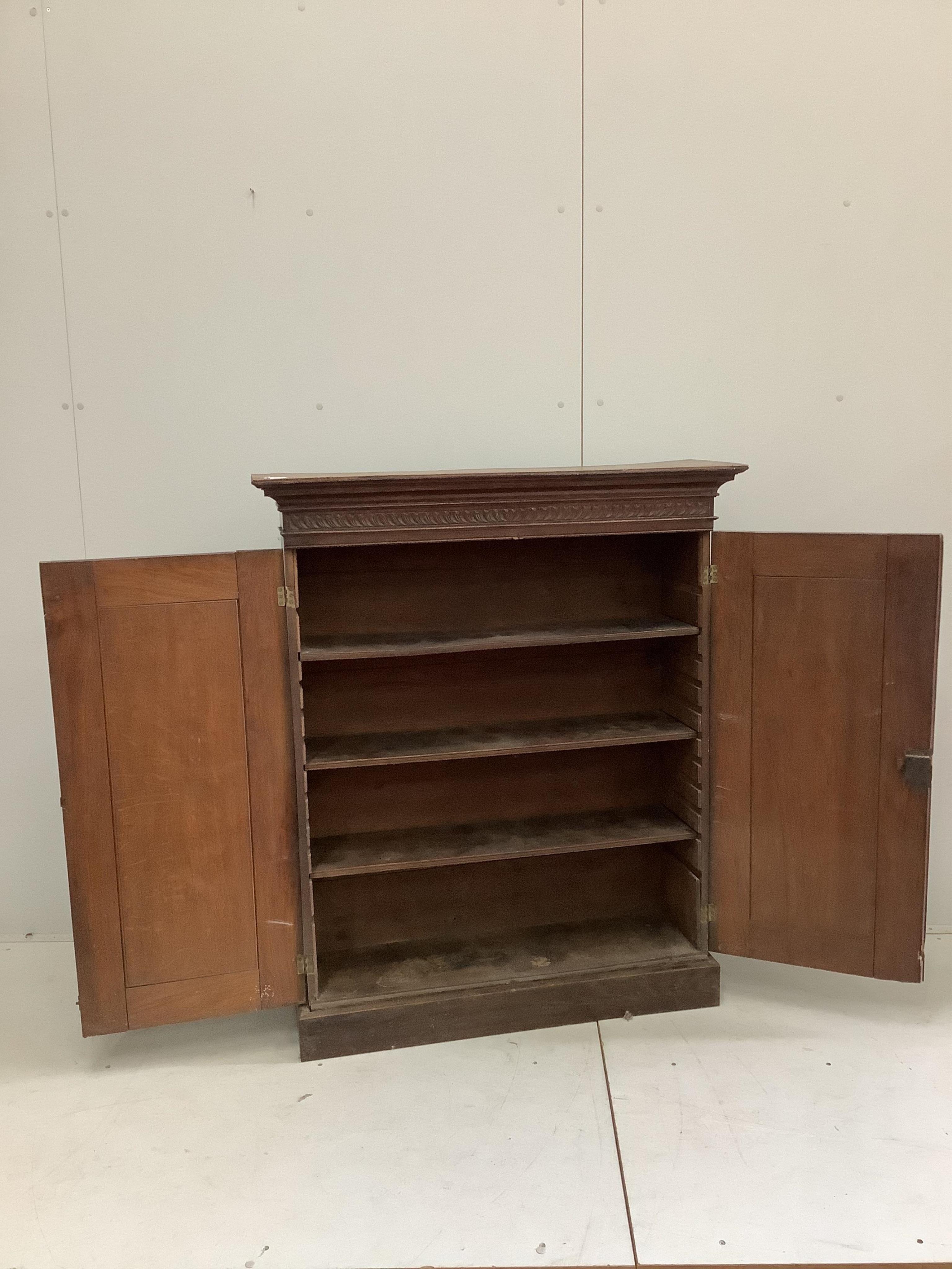 A Victorian carved oak side cabinet, width 99cm, depth 31cm, height 119cm. Condition - fair